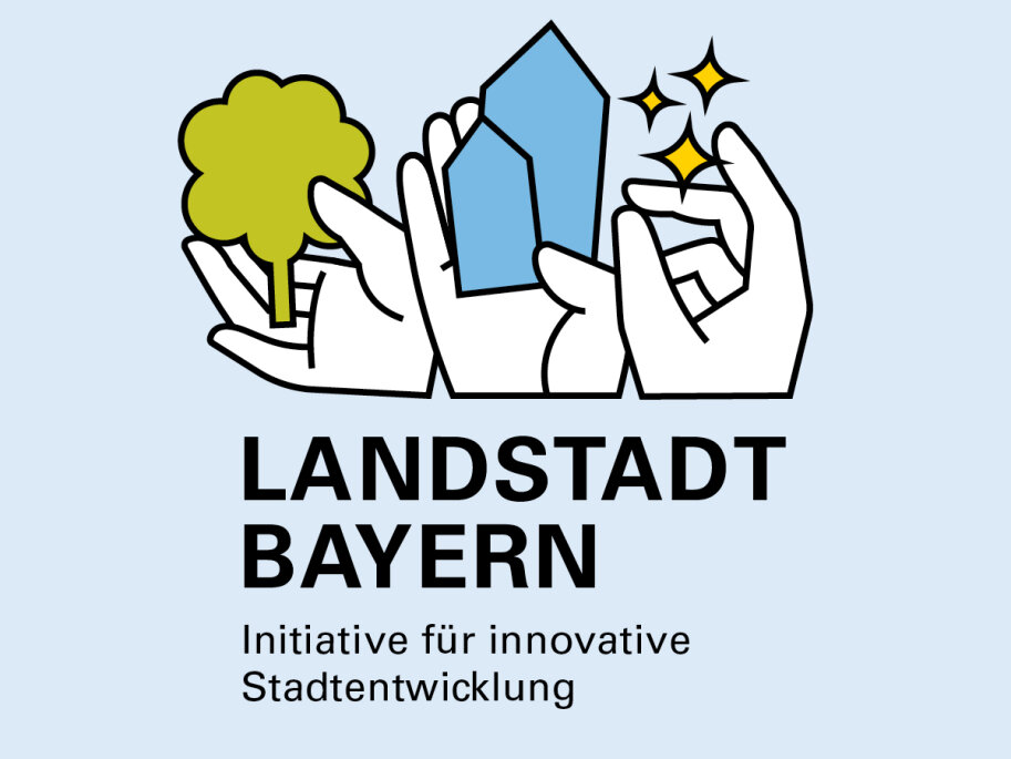 Das Logo LANDSTADT BAYERN zeigt drei Hände. Eine Hand hält einen Baum als Sinnbild für das Land. Eine Hand hält zwei Häuser als Sinnbild für die Stadt. In der dritten Hand sind Sterne als Sinnbild für Innovationen. 